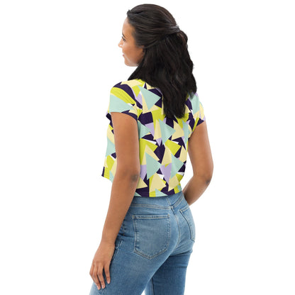 Good Wishes 365 crop tee with multi-colored geometric triangle print worn by a woman, back view.