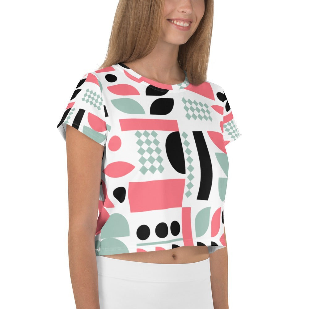 Good Wishes 365 crop tee with pink, mint, and black geometric abstract print on a woman