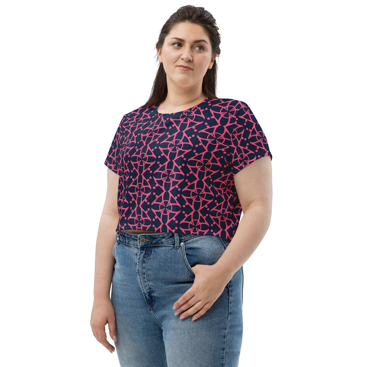 Good Wishes 365 navy blue crop tee with vibrant pink geometric pattern worn by a woman with blue jeans