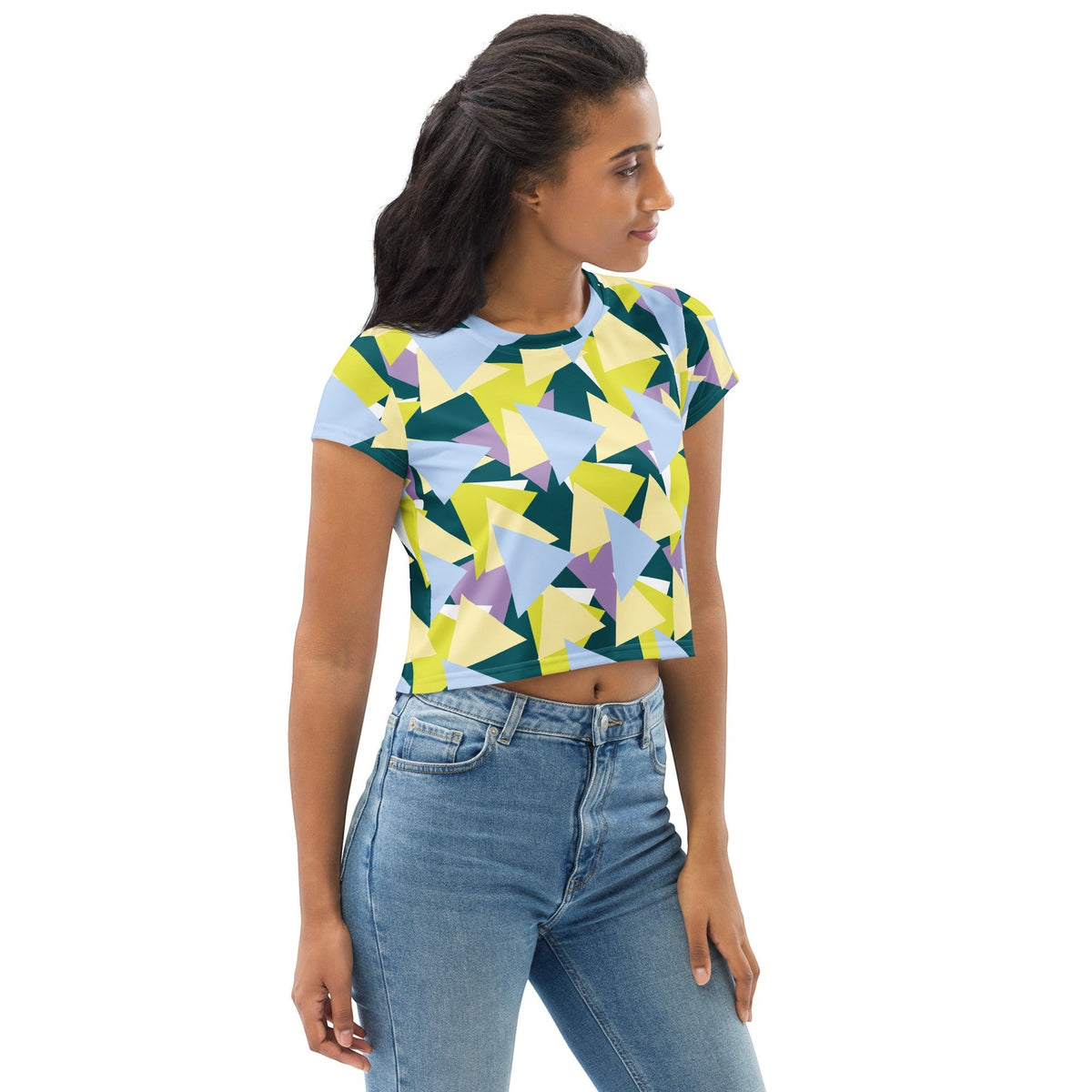 Good Wishes 365 model wearing a multi-colored geometric triangle print crew neck crop tee with blue jeans.