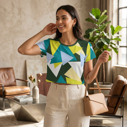 Good Wishes 365 crop tee with geometric triangle print in green, yellow, and blue, worn by a smiling woman.