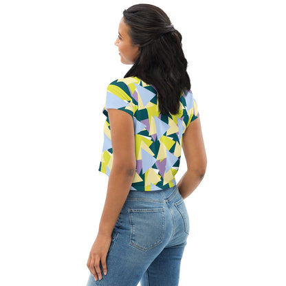 Good Wishes 365 crop tee with a multi-colored geometric triangle pattern worn by a woman from a back view.