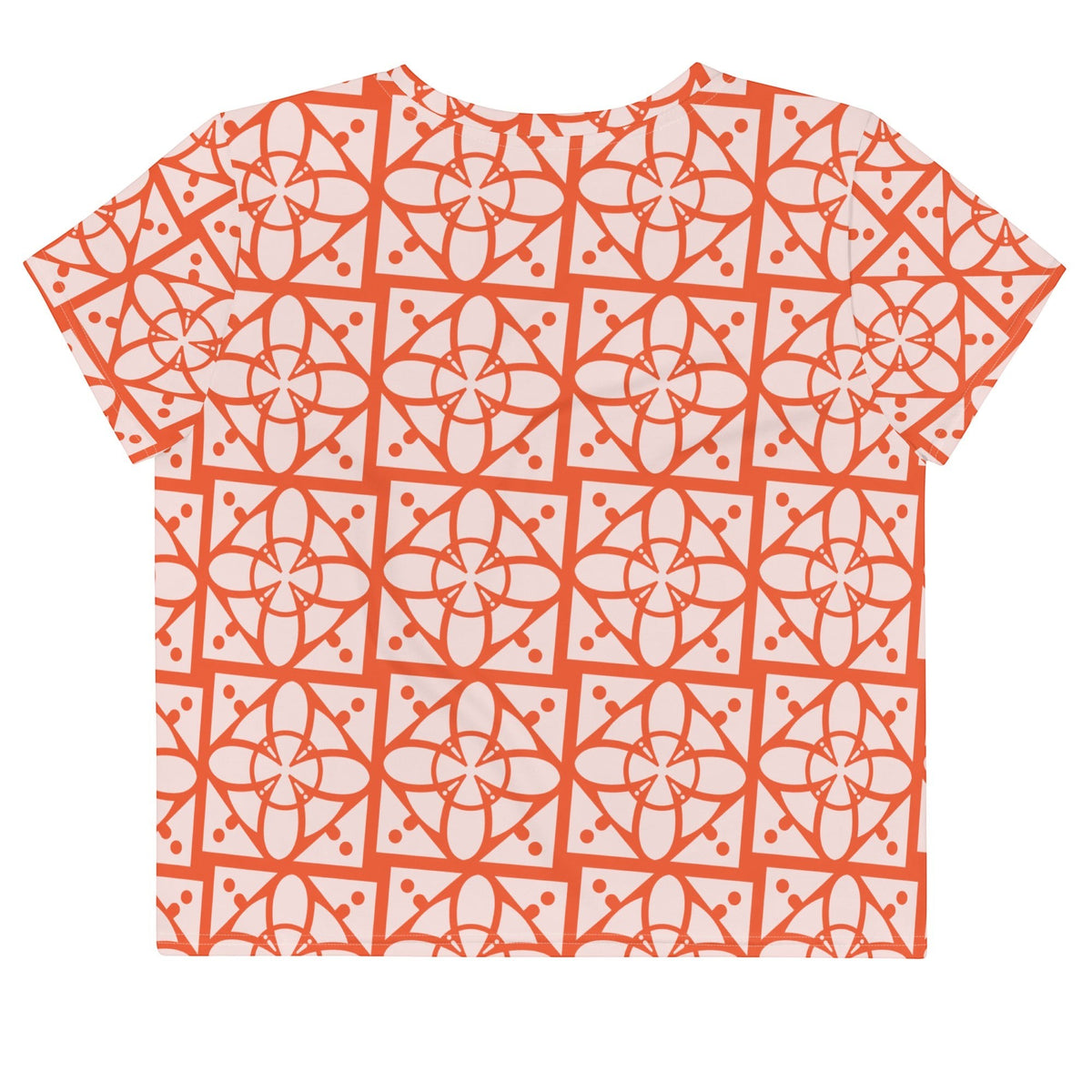 Good Wishes 365 crop tee with a vibrant orange and light pink geometric all-over pattern on stretchy jersey fabric.