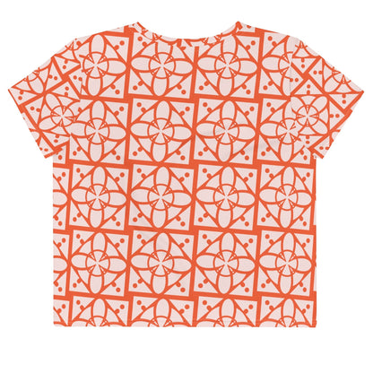 Good Wishes 365 crop tee with a vibrant orange and light pink geometric all-over pattern on stretchy jersey fabric.