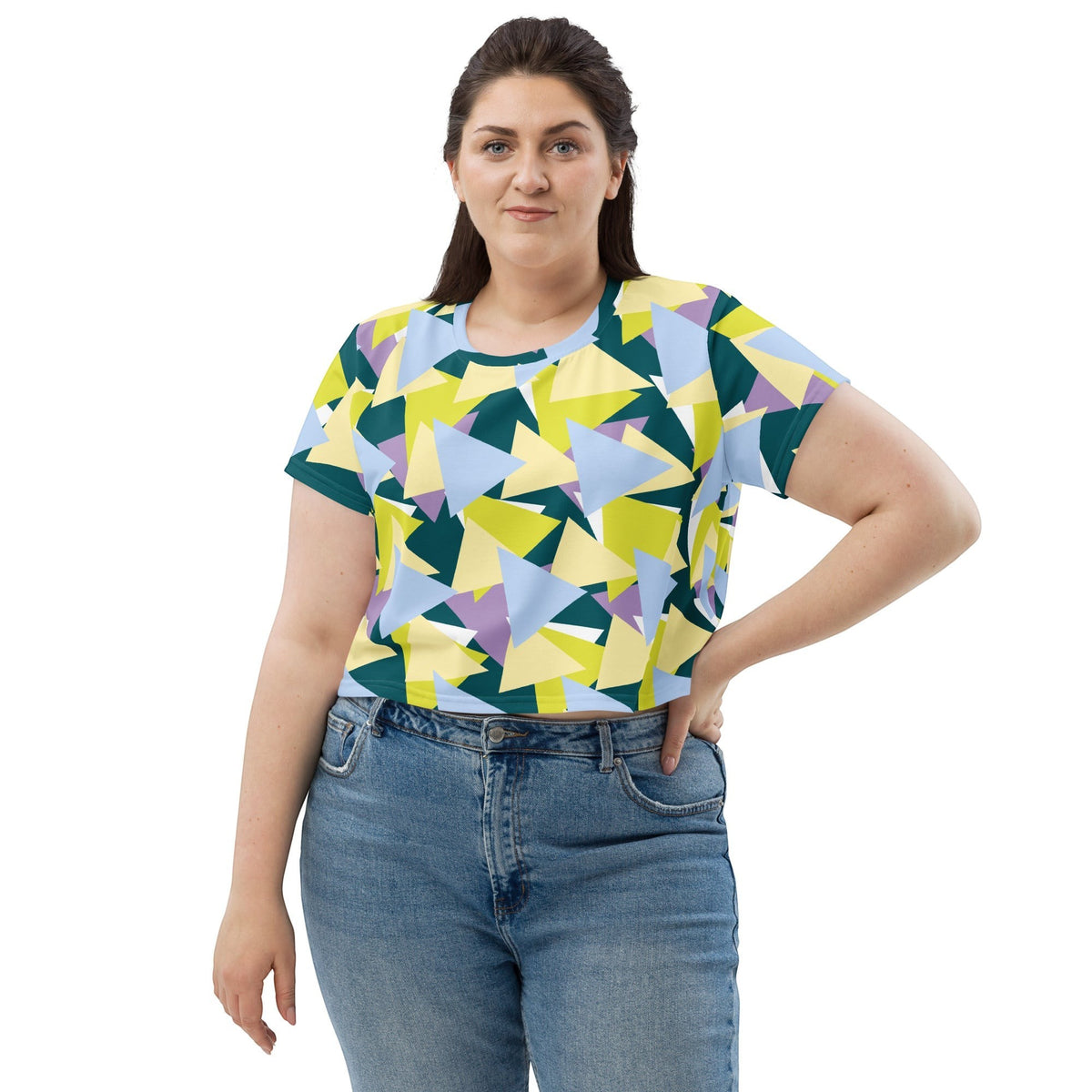 Good Wishes 365 multi-colored geometric print crew neck crop tee worn by a woman with blue jeans.