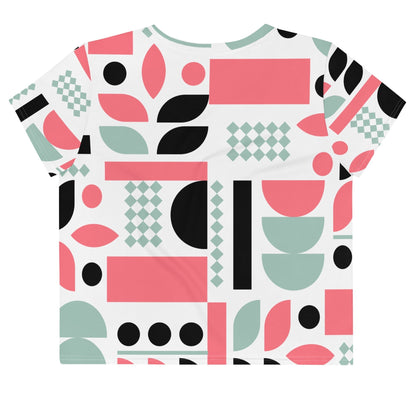 Good Wishes 365 crop tee with a white base and pink, mint green, and black geometric abstract pattern.