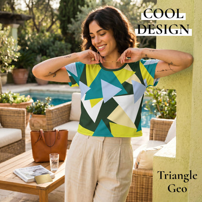 Good Wishes 365 crop tee with geometric triangle print in green, blue, and white, worn by a smiling woman outdoors.