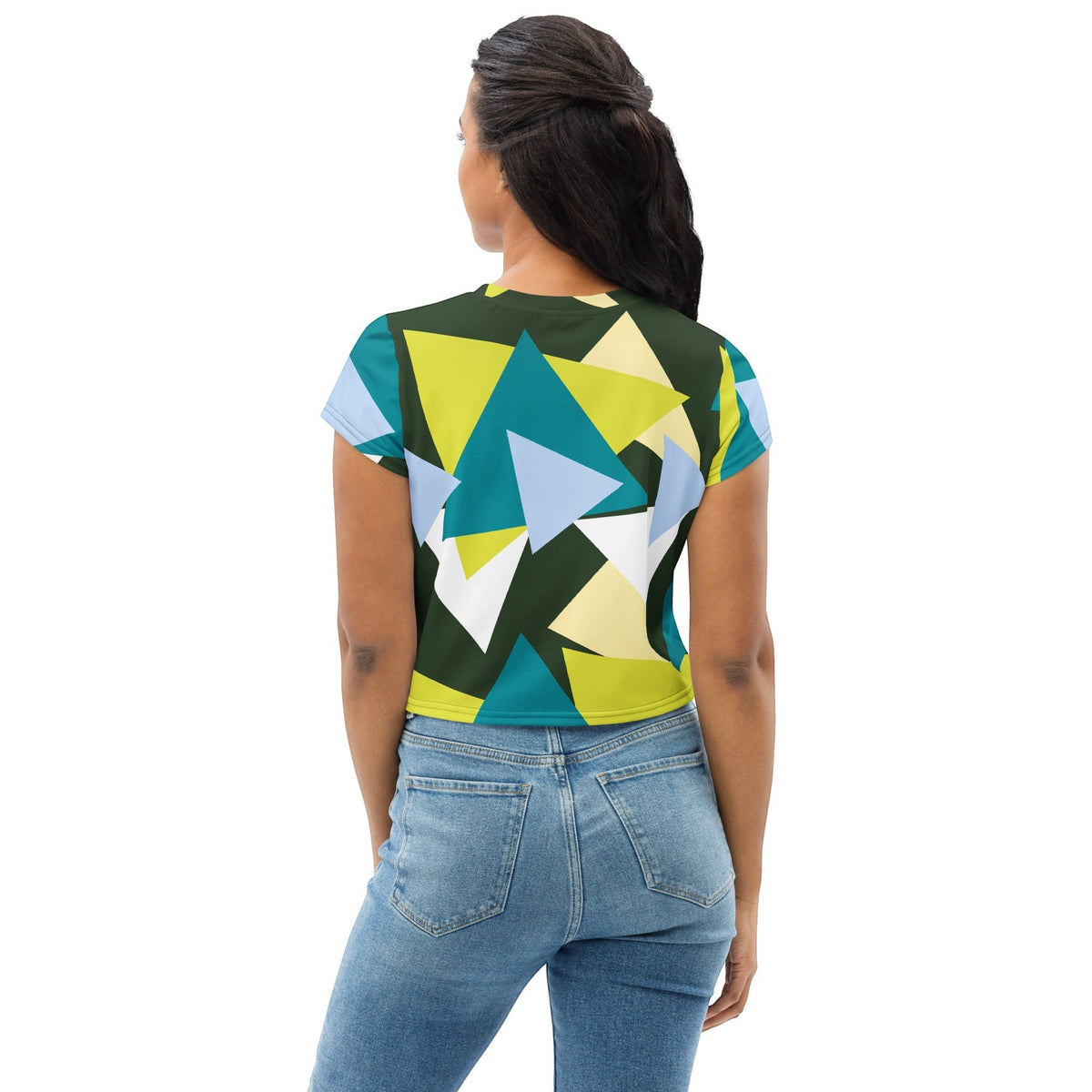 Good Wishes 365 crop top with forest green, lime, and sky blue geometric triangle print worn with blue denim jeans