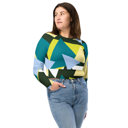 Good Wishes 365 long-sleeve crop top with a geometric triangle print in forest green, lime, and sky blue on a model.