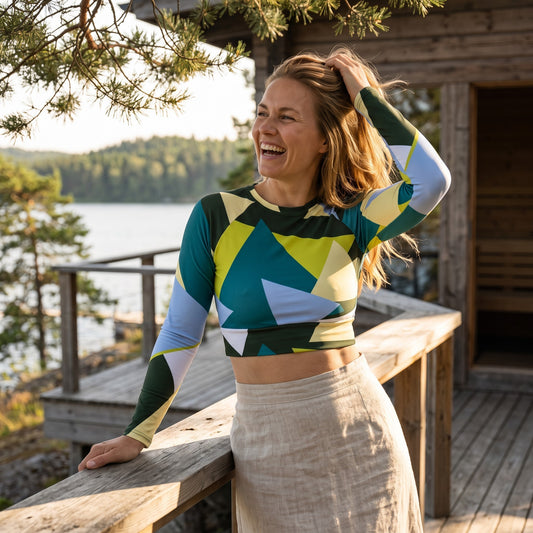 Good Wishes 365 long-sleeve crop top with geometric print in forest green, lime, and blue worn by a smiling woman