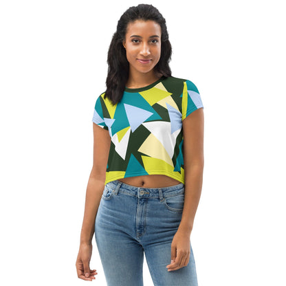 Good Wishes 365 model wearing a short sleeve crop top with a forest green, lime, and sky blue geometric triangle print