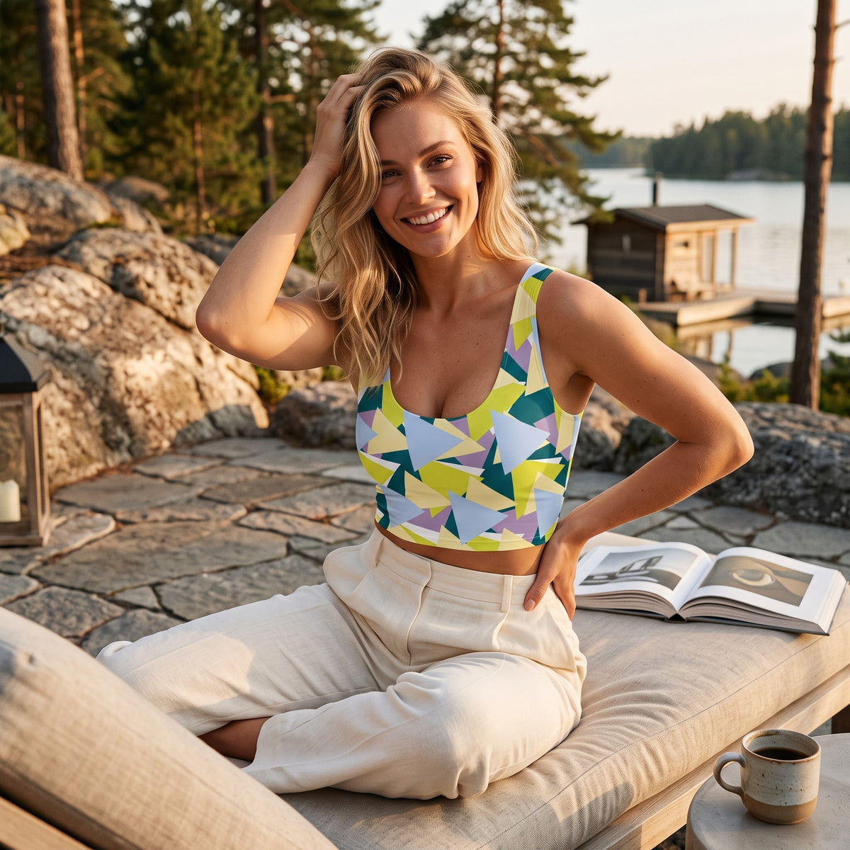 Good Wishes 365 sleeveless crop top with lime, blue, and teal geometric triangle print worn by a smiling woman outdoors