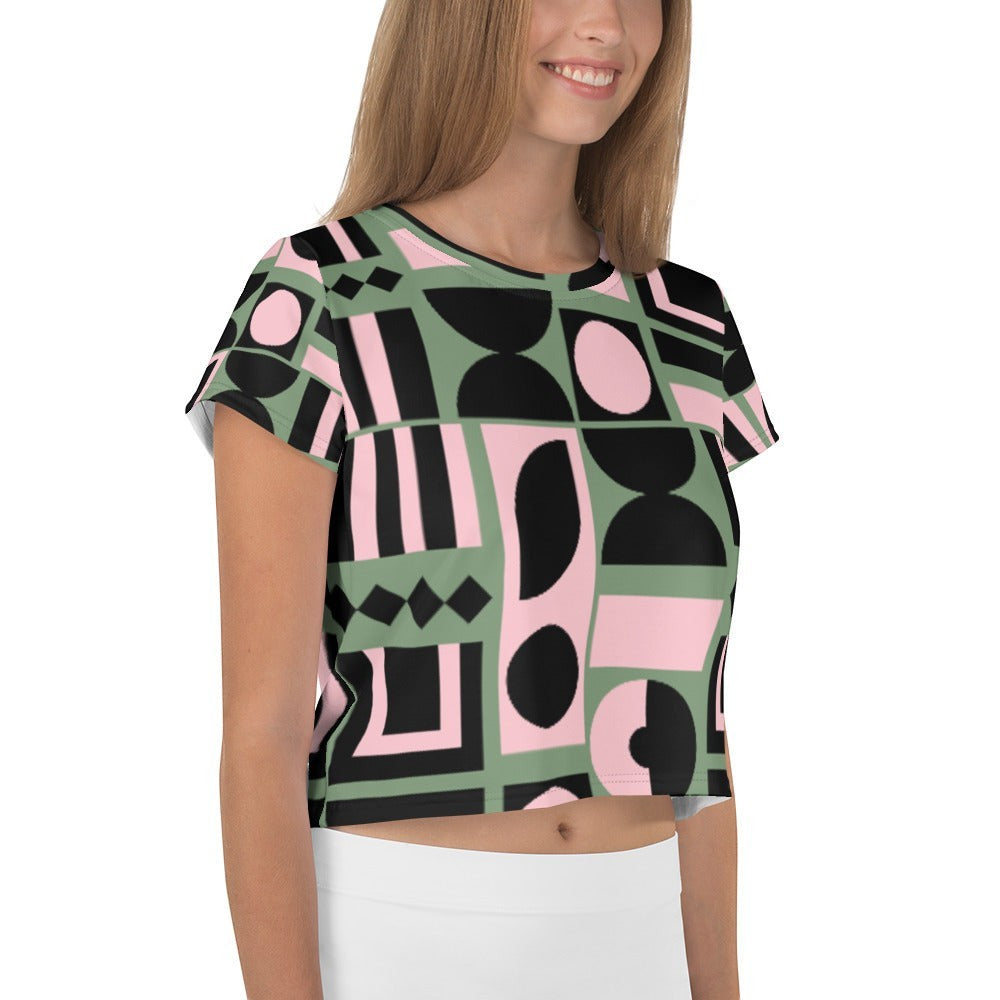 Good Wishes 365 cropped t-shirt with sage green, pink, and black abstract geometric print on a smiling model