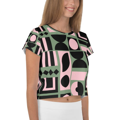 Good Wishes 365 cropped t-shirt with sage green, pink, and black abstract geometric print on a smiling model