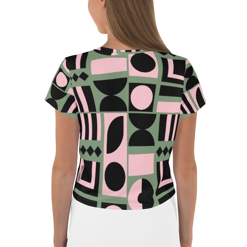 Good Wishes 365 cropped t-shirt with a sage green, pink, and black geometric print, shown from the back.