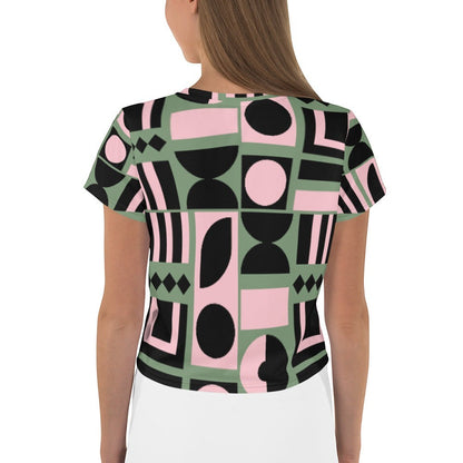 Good Wishes 365 cropped t-shirt with a sage green, pink, and black geometric print, shown from the back.