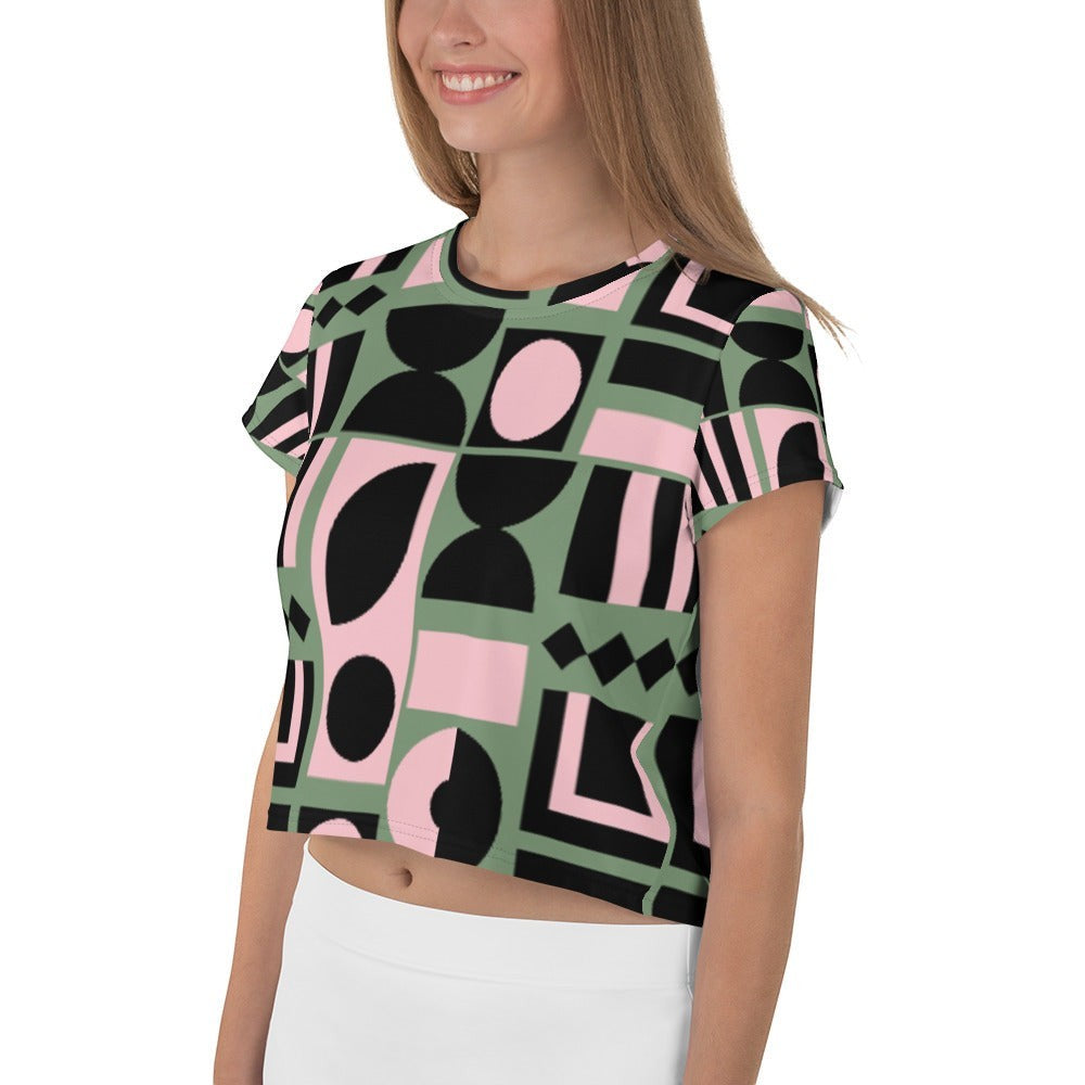 Good Wishes 365 cropped t-shirt with sage green, pink, and black geometric print on a smiling woman