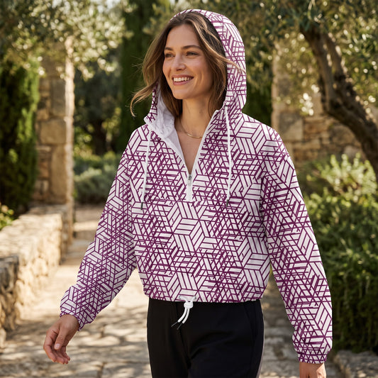 Good Wishes 365 women's cropped windbreaker with purple geometric trapezoidal print, half-zip, and hood in a garden.