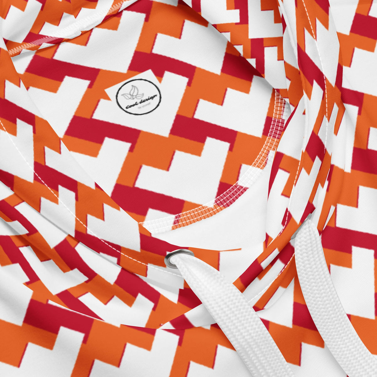 Good Wishes 365 unisex hoodie featuring a red and orange geometric heart pattern on a white background with drawstrings