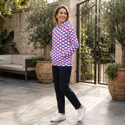 Good Wishes 365 unisex recycled hoodie with purple and red geometric heart print worn by a smiling woman outdoors.