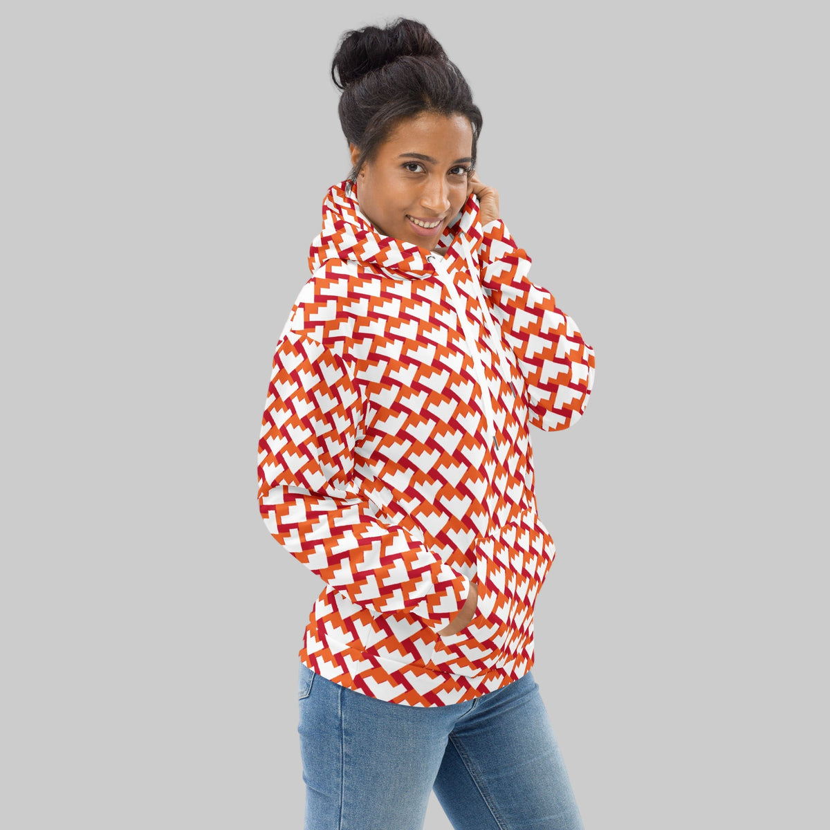 Good Wishes 365 unisex hoodie with red and orange geometric heart pattern, featuring a kangaroo pocket and hood.