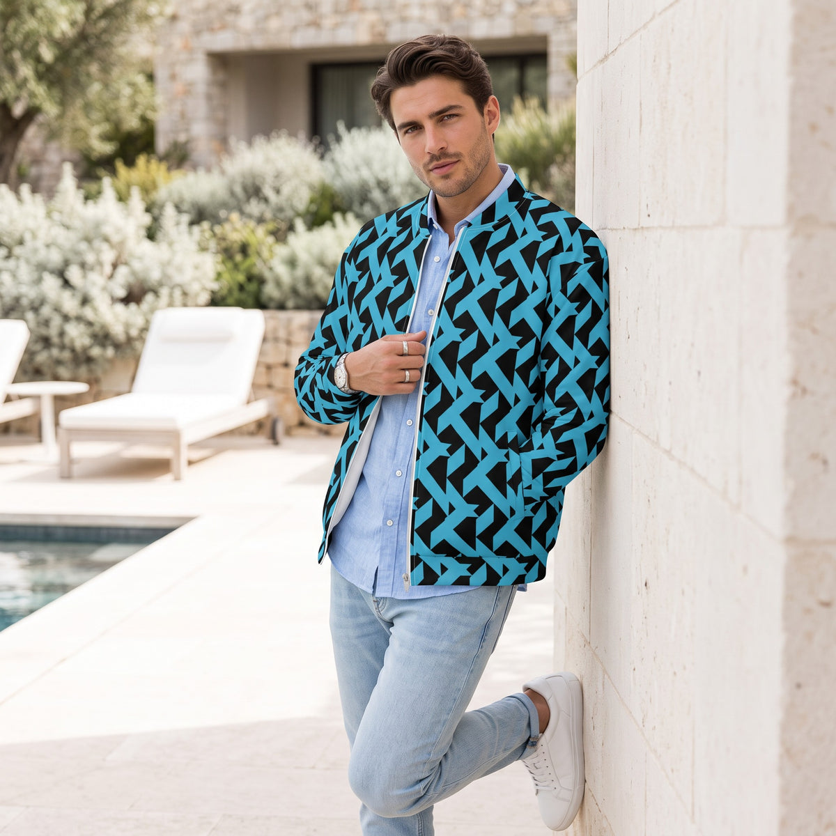 Good Wishes 365 unisex bomber jacket with blue and black geometric maze print, worn by a man outdoors.
