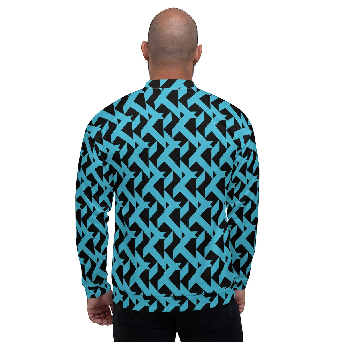 Back view of a man wearing a Good Wishes 365 bomber jacket with a bold blue and black geometric maze print.