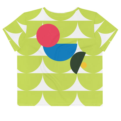 Good Wishes 365 lime green crop tee featuring an abstract geometric mushroom pattern in pink, blue, and forest green.