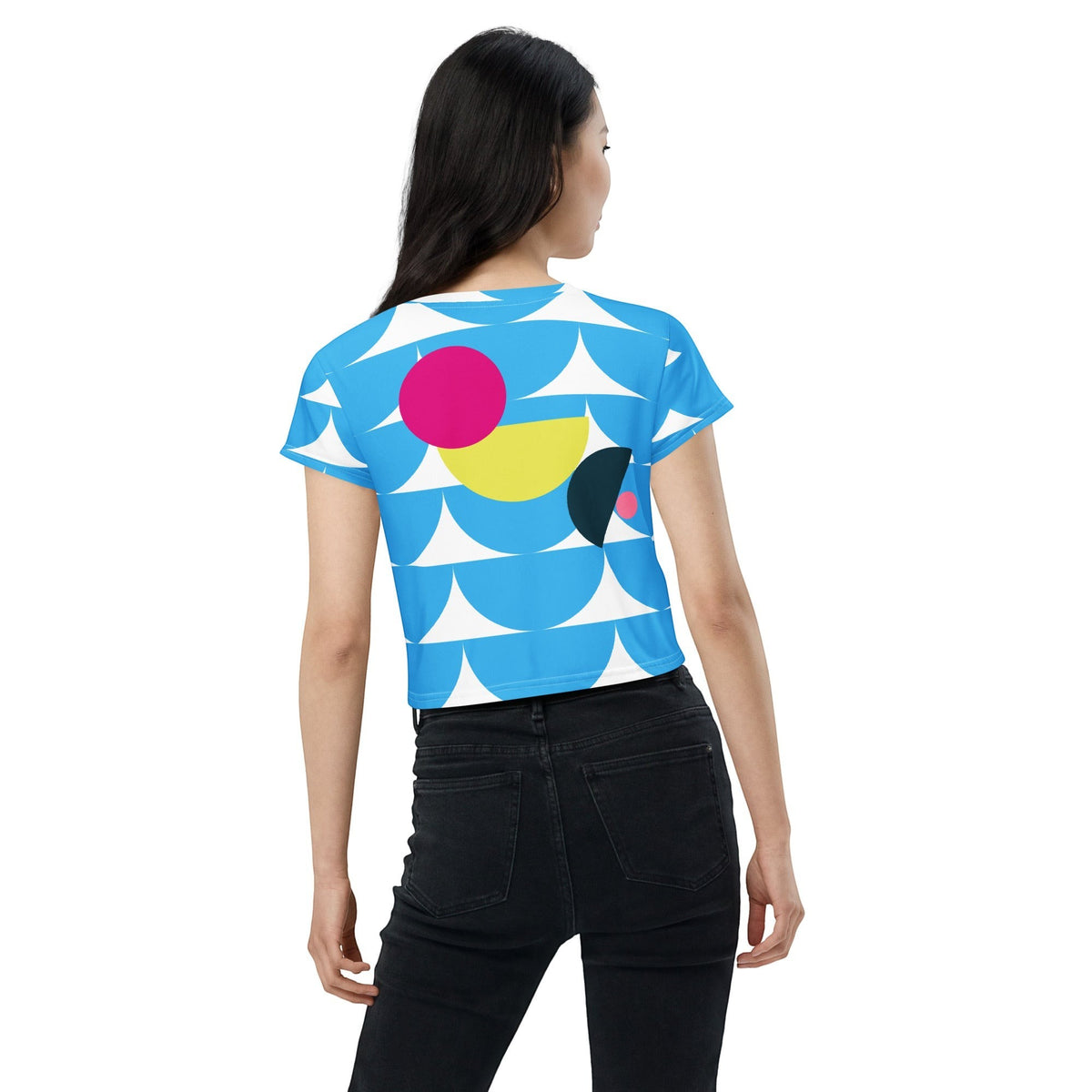 Good Wishes 365 sky blue crop tee with geometric mushroom graphic print worn by a woman from the back view.
