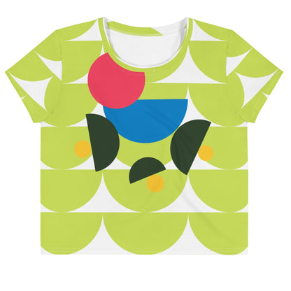 Good Wishes 365 lime green crop tee with abstract geometric mushroom graphic in pink, blue, and forest green.