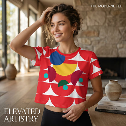 Good Wishes 365 red geometric mushroom print crop tee worn by a smiling woman in a bright living room setting.