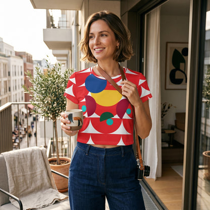 Good Wishes 365 crop tee with red geometric mushroom print worn by a woman holding a mug on a balcony