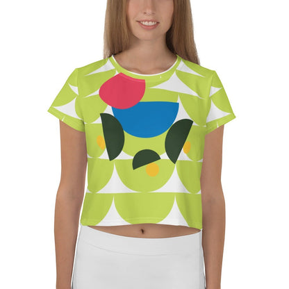 Good Wishes 365 lime green crop tee with abstract geometric mushroom graphic in pink, blue, and forest green.