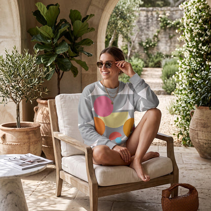 Good Wishes 365 recycled sweatshirt with silver geometric mushroom print worn by a woman in a sunny garden setting.