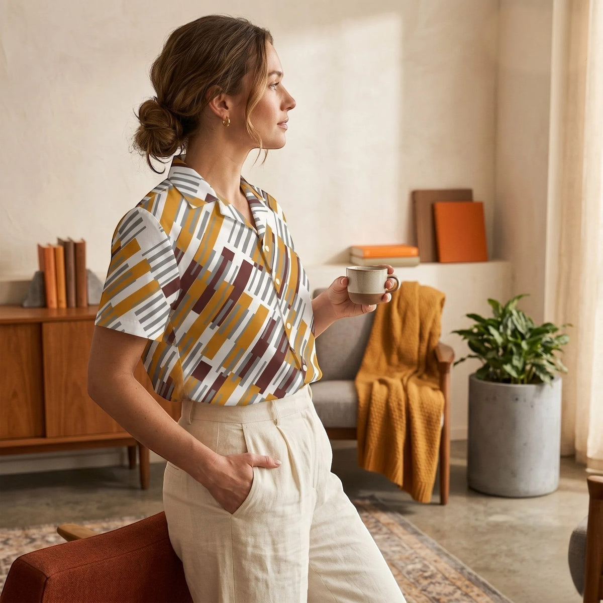 Good Wishes 365 short sleeve button down shirt with mustard, burgundy, and grey geometric print on a woman