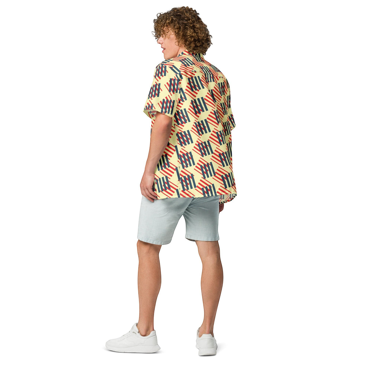 Good Wishes 365 men's short sleeve button-down shirt with red, navy, and cream geometric print, worn with light shorts.