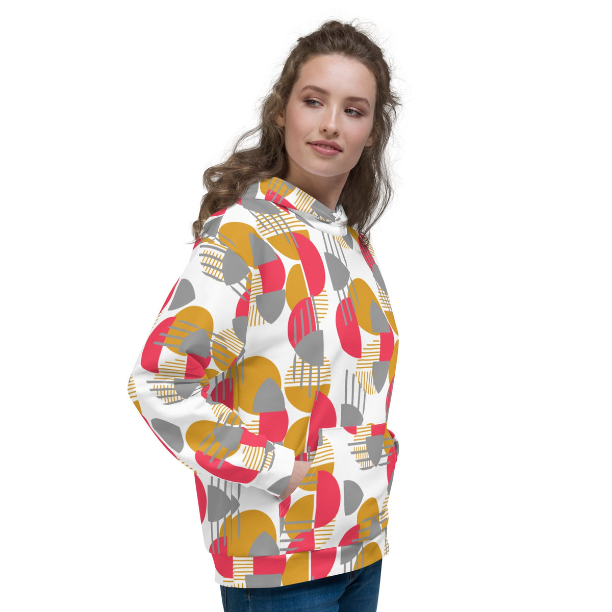 Good Wishes 365 recycled hoodie with rose red, mustard, and silver geometric print on a woman in a side view
