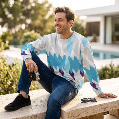Good Wishes 365 unisex sweatshirt with blue and purple geometric print worn by a smiling man holding a vintage camera