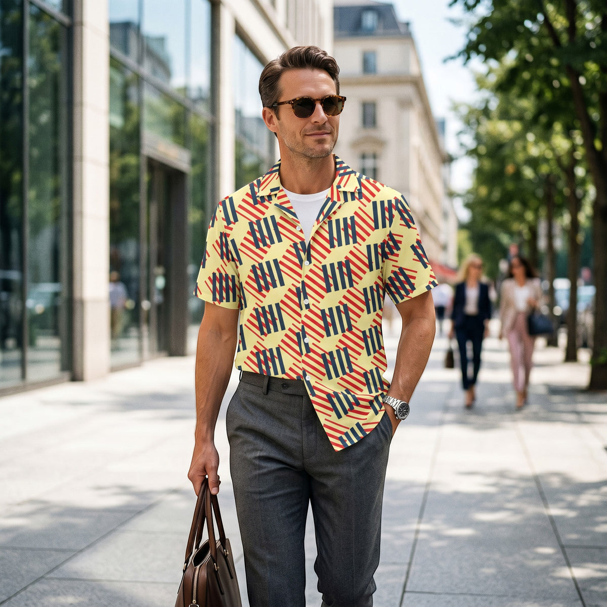 Good Wishes 365 men's short sleeve button-down shirt with a geometric red, navy, and yellow pattern on a city street. All-over print, unisex button shirt,.
