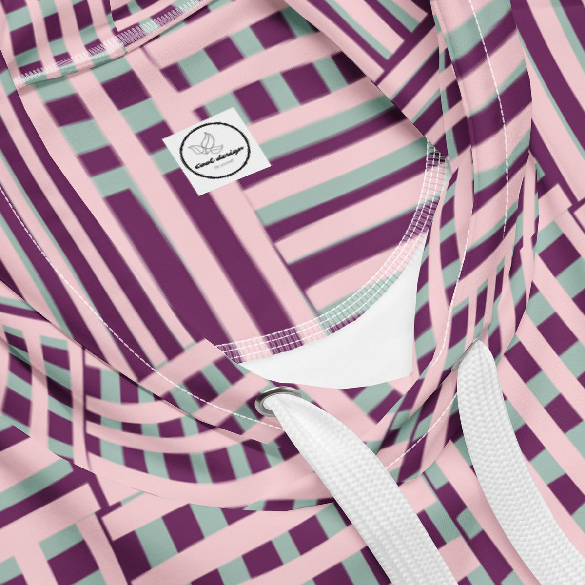 Good Wishes 365 recycled hoodie featuring a vibrant purple, pink, and blue geometric stripe pattern with white drawstrings