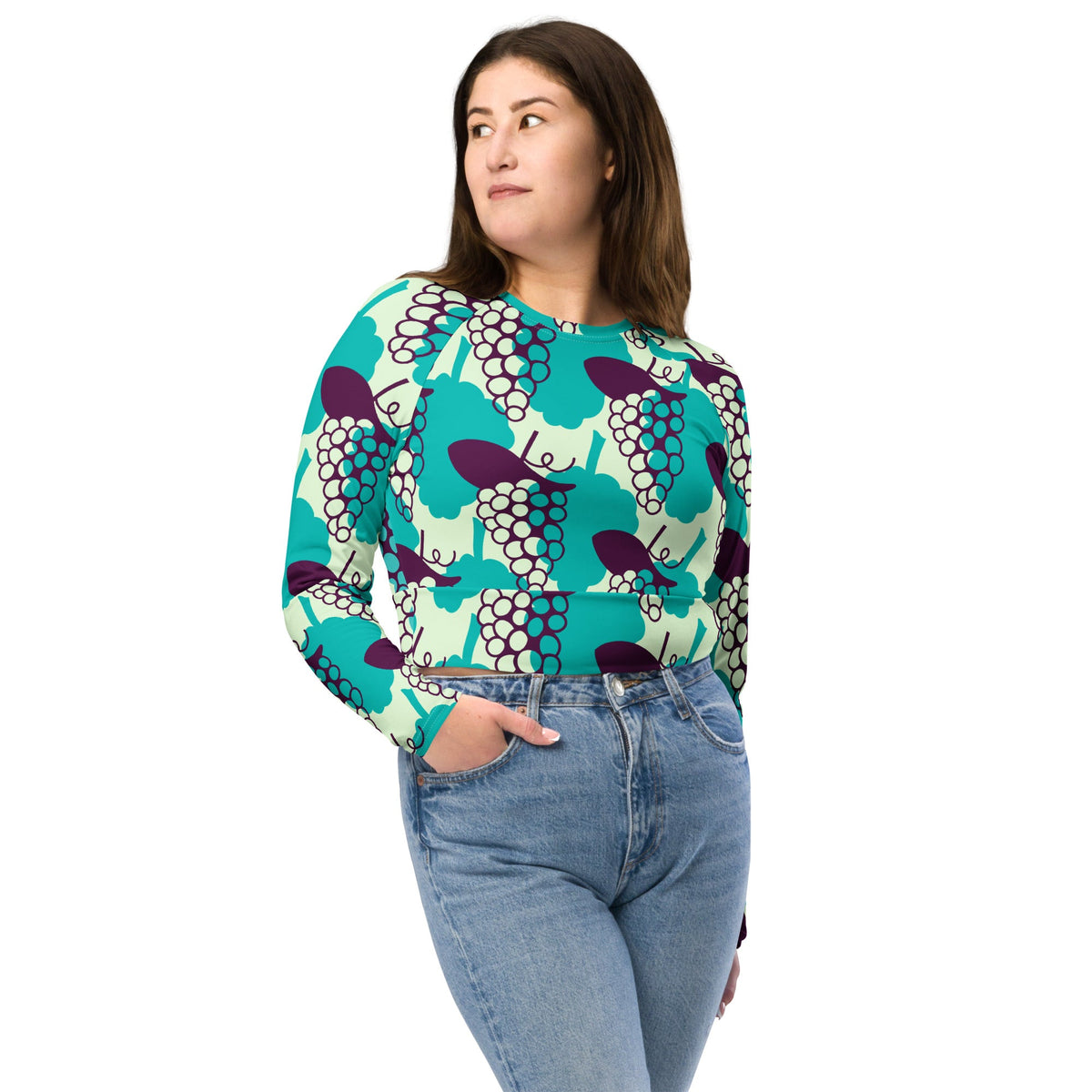 Good Wishes 365 long-sleeve crop top with a vibrant grape pattern, featuring UPF 50+ recycled fabric and raglan sleeves.
