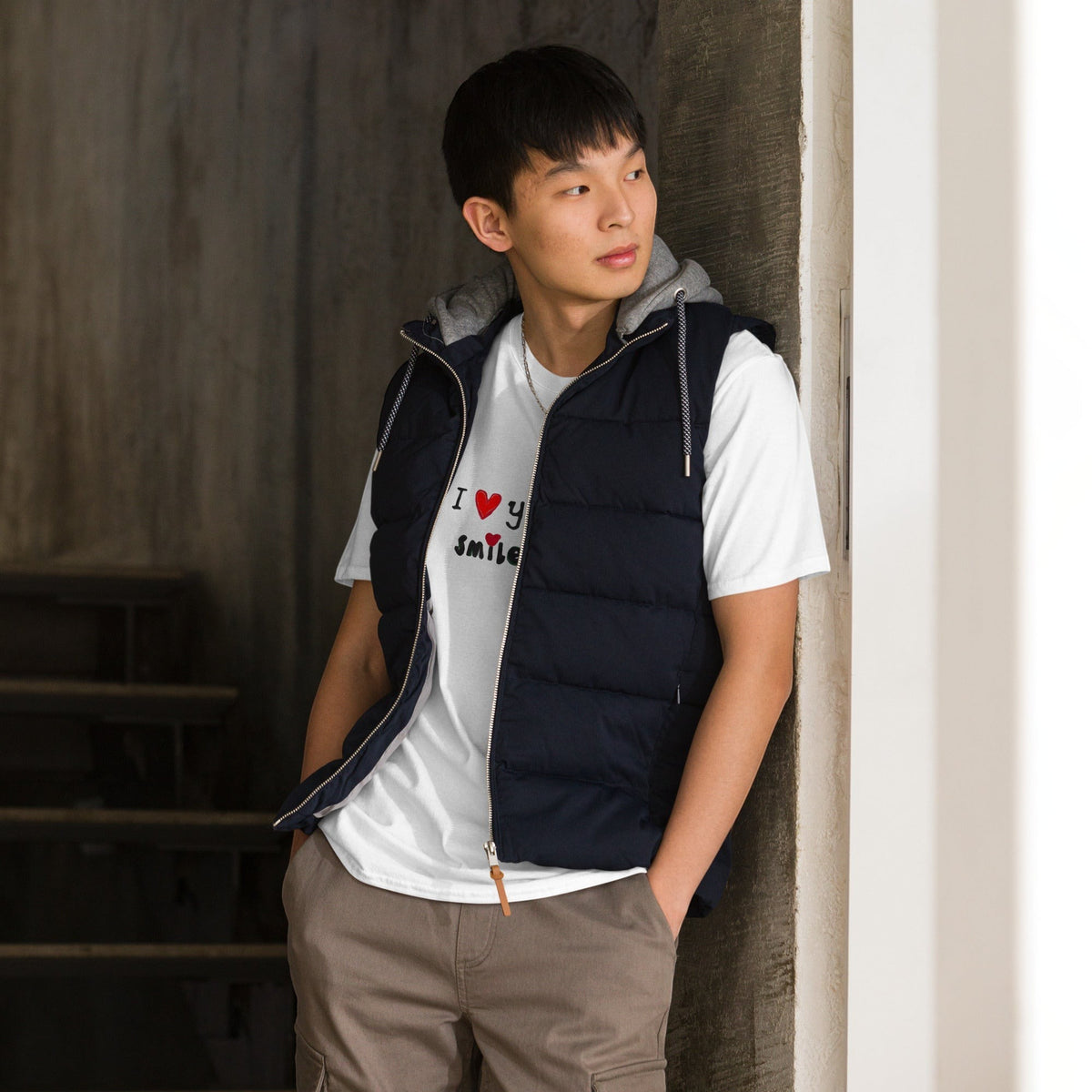 Good Wishes 365 white crewneck t-shirt with I Love Your Smile graphic worn by a man in a navy puffer vest