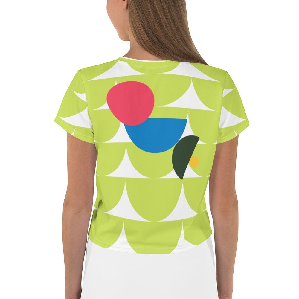 Good Wishes 365 green crop tee with abstract geometric mushroom graphic in pink, blue, and forest green on back view