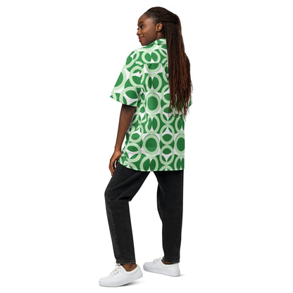 Good Wishes 365 unisex short sleeve button shirt with green and white retro geometric pattern worn by a woman