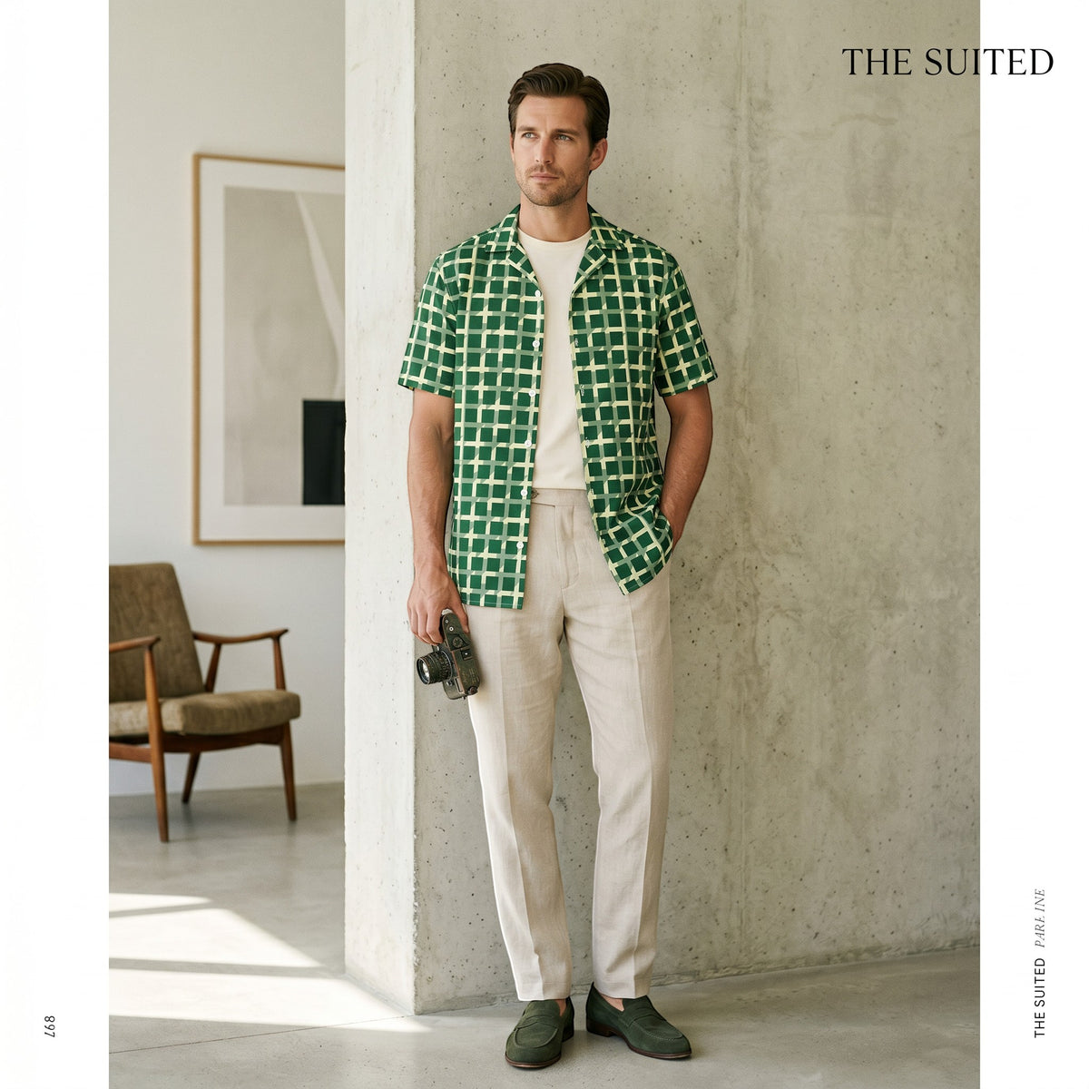 Good Wishes 365 men's green geometric checkered short sleeve button shirt worn open over a white tee with beige trousers