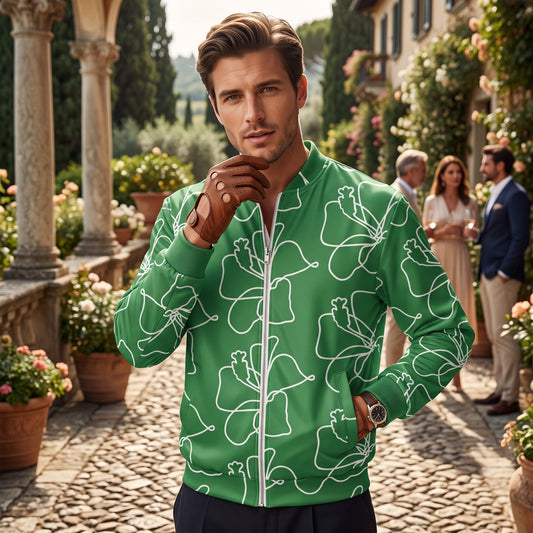 Good Wishes 365 green bomber jacket with white hibiscus line art worn by a man in a garden setting
