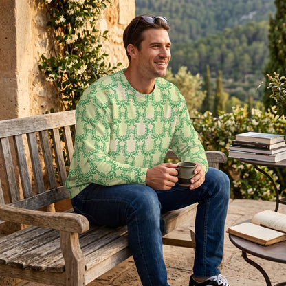Good Wishes 365 unisex sweatshirt in snow flurry green with laurel leaf crown print worn by a man on a garden bench