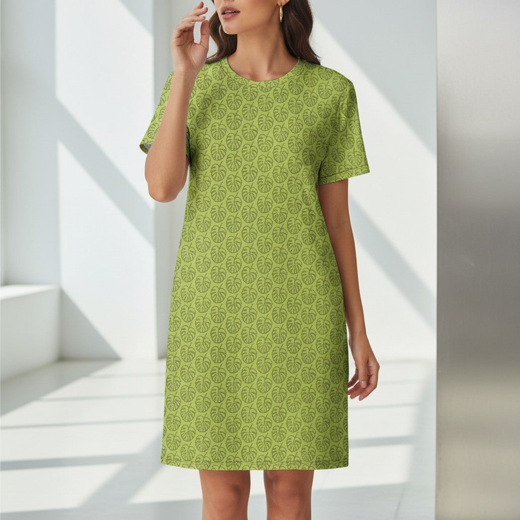 Good Wishes 365 green t-shirt dress with all-over monstera leaf print and dropped shoulders.