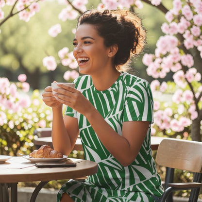 Good Wishes 365 green and white abstract print t-shirt dress made from polyester and spandex with an oversized fit.