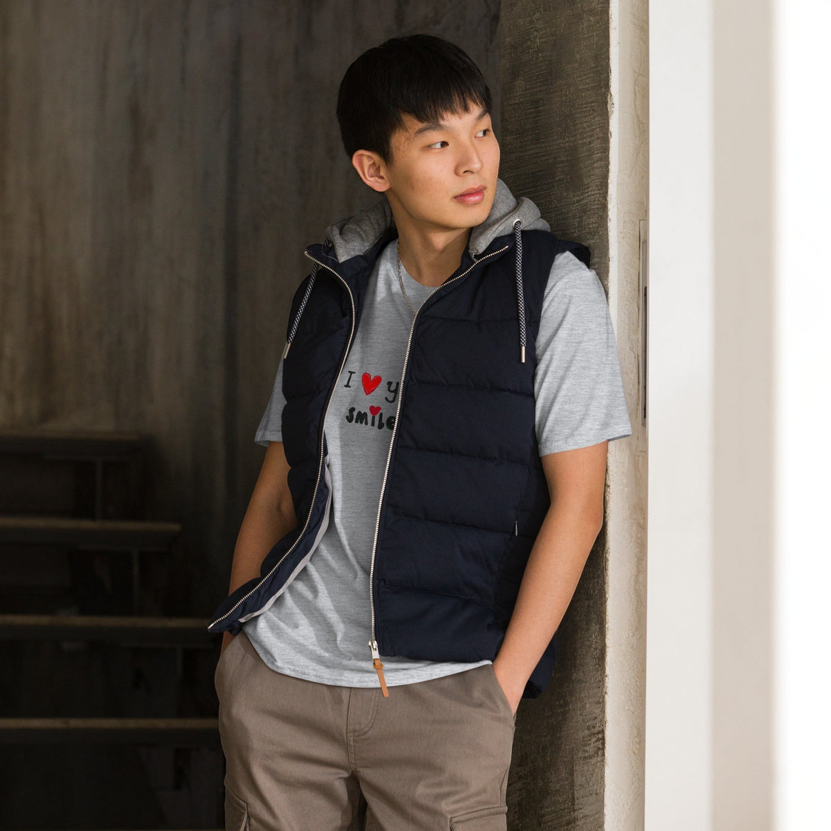 Good Wishes 365 unisex grey graphic t-shirt with I Love Your Smile print worn by a man in a navy puffer vest